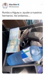 Con una pistola, un fajo de dinero y una botella de agua diputado “ayudará” a pobladores de Higüey
